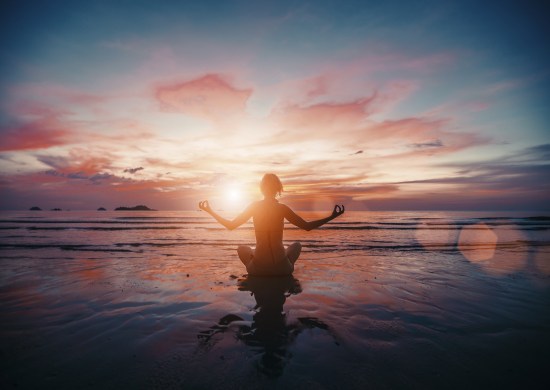 woman meditation on beach